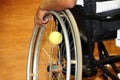 Physically disabled athlete playing tennis in wheelchair