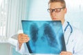 Physician looks at x-ray picture Royalty Free Stock Photo