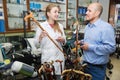 Physician offering cane to customer