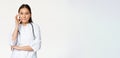 Physician-patient privilege, medical confidentiality. Asian woman doctor showing silence, mouth zip gesture, secret Royalty Free Stock Photo