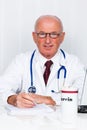 Physician in practice with stethoscope and laptop. Royalty Free Stock Photo