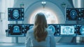 A physician\'s dedication to interpreting brain scans on screens adjacent to MRI