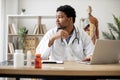 Physician typing on laptop and making notes in clinic Royalty Free Stock Photo