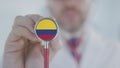 Physician uses stethoscope with the Colombian flag. Healthcare in Colombia