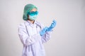 Physician wearing glove concept, Gray isolated background