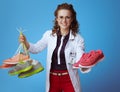 Physician woman giving one pair of fitness sneakers
