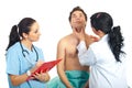 Physician woman examine neck male patient Royalty Free Stock Photo