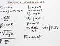 Physics formulas written on a white paper