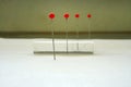 Pins are placed in front of and behind a square glass rod to study the refraction of light. Royalty Free Stock Photo