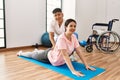 Physioterapist man giving treatment to woman at the clinic Royalty Free Stock Photo