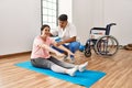 Physioterapist man giving treatment to woman at the clinic Royalty Free Stock Photo