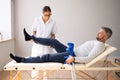 Physiotherapist Checking Man Patient Knee Royalty Free Stock Photo
