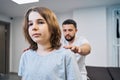 Physiotherapist doctor examines girl neck, spine in medical center closeup portrait. Chiropractor