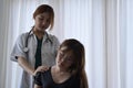 Physiotherapist examining female patient with neck injuries. Rehabilitation physiotherapy concept.
