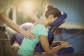 Physiotherapist giving back massage to a female patient