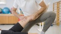 Rehabilitation leg treatment to a female patient