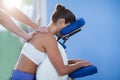 Physiotherapist giving shoulder massage to a female patient Royalty Free Stock Photo