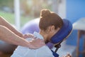 Physiotherapist giving shoulder massage to a female patient Royalty Free Stock Photo