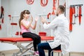 Physiotherapist with junior girl in the rehabilitation clinic Royalty Free Stock Photo