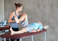 Physiotherapist, legs and elderly man with physical therapy exercise at rehabilitation center. Medical, help and Royalty Free Stock Photo