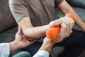 Physiotherapist man giving exercise with dumbbell treatment About Arm and Shoulder of athlete male patient Physical therapy Royalty Free Stock Photo