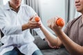 Physiotherapist man giving exercise with dumbbell treatment About Arm and Shoulder of athlete male patient Physical therapy Visit Royalty Free Stock Photo