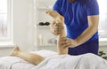 Physiotherapist massage patient leg help with recovery