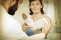 Physiotherapist putting bandage on injured hand of patient Royalty Free Stock Photo