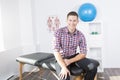 Physiotherapist rehabilitating at job