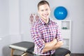 Physiotherapist rehabilitating at job