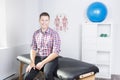 Physiotherapist rehabilitating at job