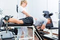 Physiotherapist or sport doctor with patient