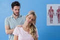 Physiotherapist stretching neck of a female patient