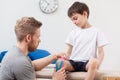 Physiotherapist taping a child