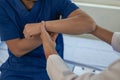 Physiotherapist treating patient at hospital Knee pain in male patient, physiotherapy concept Man Royalty Free Stock Photo