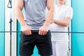 Physiotherapist working with patient in practice Royalty Free Stock Photo