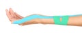 Physiotherapy concept. Female hand with physio tape n white background Royalty Free Stock Photo