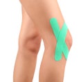 Physiotherapy concept. Female knees with physio tape Royalty Free Stock Photo