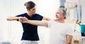 Physiotherapy, consultant and exercise with a woman physio and senior man patient in a clinic for rehabilitation Royalty Free Stock Photo