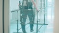 Physiotherapy of a male patient wearing exosuit