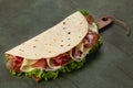 Piadina romagnola, traditional italian flatbread with prosciutto crudo di Parma