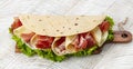 Piadina romagnola traditional italian flatbread with prosciutto crudo di Parma