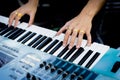 Pianist hand with ring on the piano