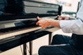 Pianist opens the keyboard lid of grand piano Royalty Free Stock Photo