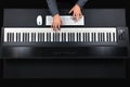 Pianist playing electric piano with jacket Royalty Free Stock Photo