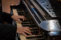 Pianist's hands in close-up while playing the piano. Piano keys during a classical music concert Royalty Free Stock Photo