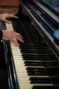 Pianist's hands in close-up while playing the piano. Piano keys during a classical music concert Royalty Free Stock Photo