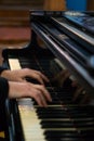 Pianist's hands in close-up while playing the piano. Piano keys during a classical music concert Royalty Free Stock Photo