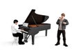Pianist sits and plays the piano and a boy with a microphone is standing next to him and sings - isolated on white background Royalty Free Stock Photo