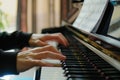 pianists hands on keys with a soft focus on the music stand Royalty Free Stock Photo